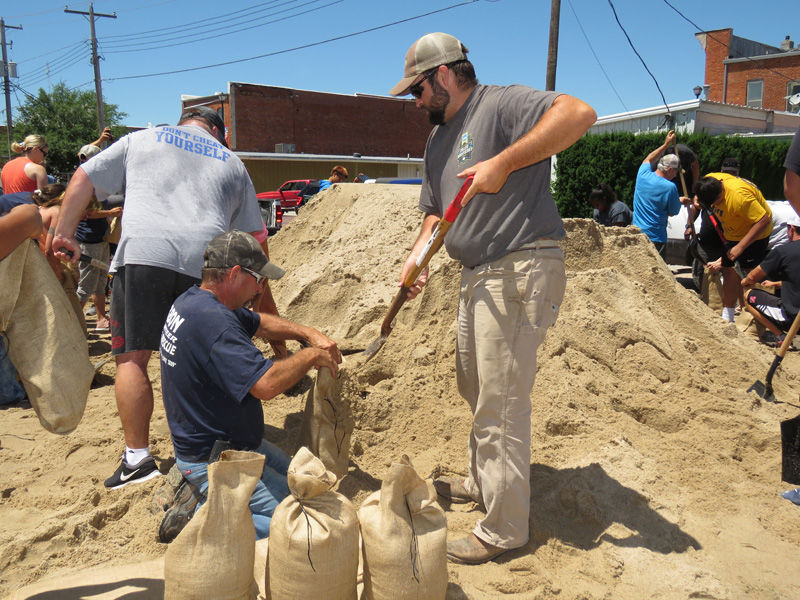 Filling sandbags in Gibbon